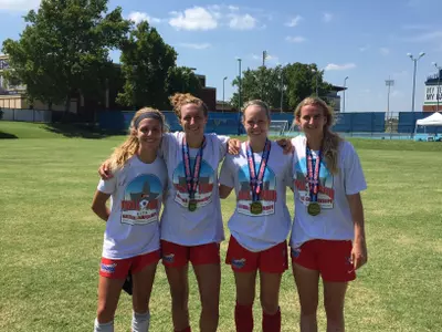 Luba (far right) won a WPSL title this summer with former MU teammates Jacie Jermier, Morgan Proffitt and Ashley Handwork on the Red Stars Reserves.