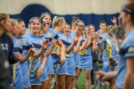 Women's Lax huddle