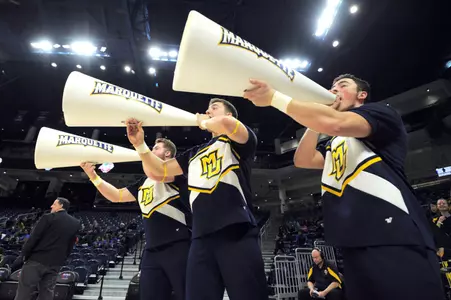 Mar 5, 2018; Chicago, IL, USA; Marquette Golden Eagles cheerleaders yell during the second half against the Creighton Bluejays of a semifinal game in the women's Big East Conference tournament at the Wintrust Arena. The Golden Eagles won 76-70 to advance to the championship game. Mandatory Credit: Patrick Gorski-USA TODAY Sport