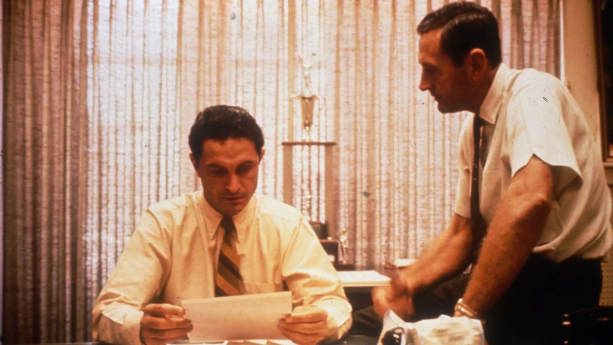 Men's basketball coaches Al McGuire and Hank Raymonds look over papers in McGuire's office, circa 1970.
Al McGuire and Hank Raymonds look over papers in McGuire's office, circa 1970
Al McGuire, Athletics, Coaches, Hank Raymonds, Males, Men's Basketball