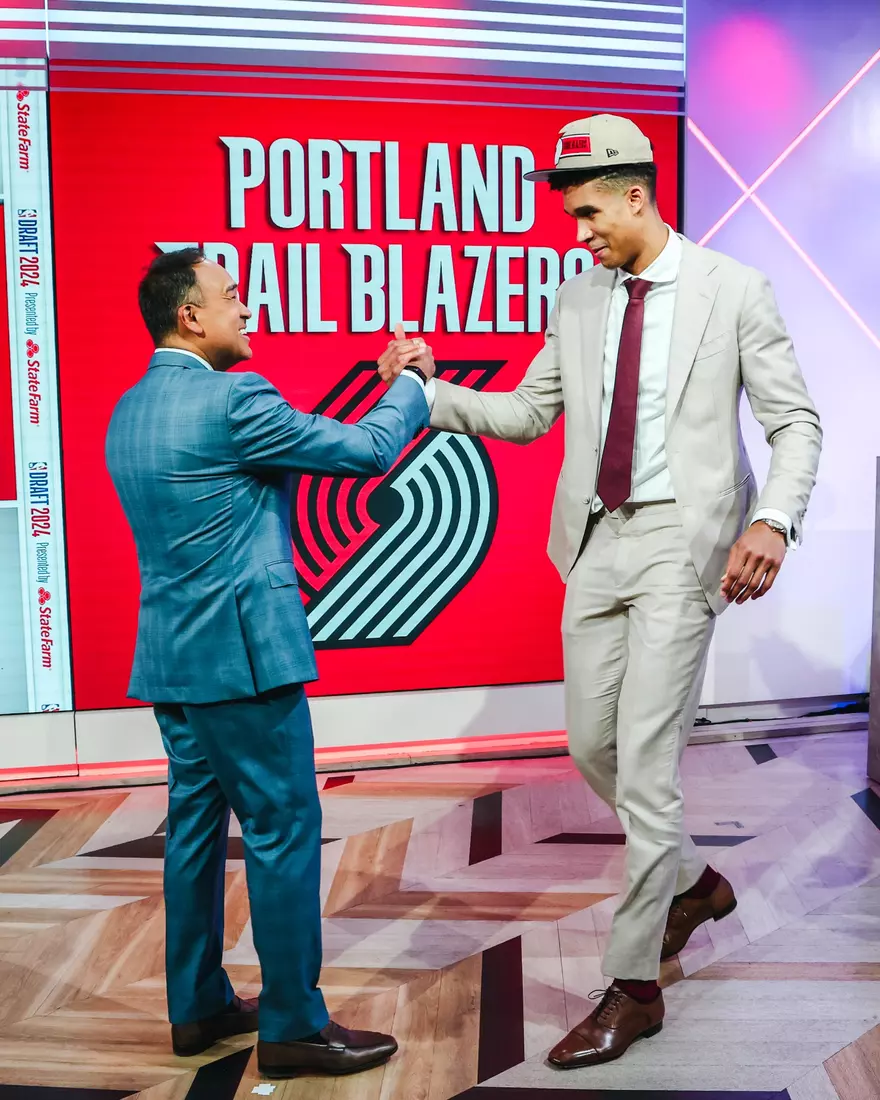 BROOKLYN, NY - JUNE 27: Osasere Ighodaro greets Mark Tatum after being drafted by the Portland Trail Blazers during the 2024 NBA Draft - Round Two on June 27, 2024 at Barclays Center in Brooklyn, New York. NOTE TO USER: User expressly acknowledges and agrees that, by downloading and or using this photograph, User is consenting to the terms and conditions of the Getty Images License Agreement. Mandatory Copyright Notice: Copyright 2024 NBAE (Photo by Jeff Haynes/NBAE via Getty Images)