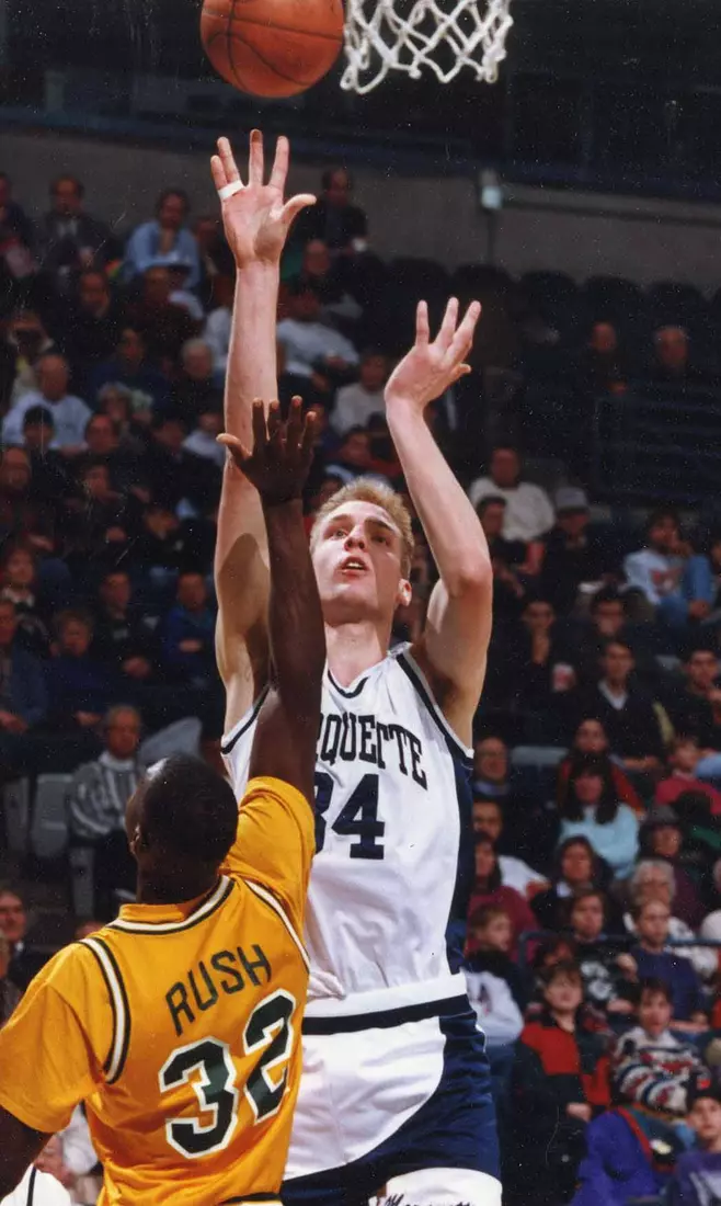 Marquette basketball player Jim McIlvaine shoots the ball, 1993-1994.