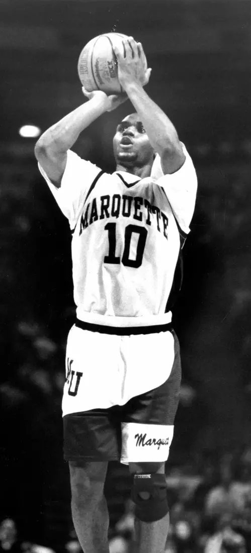Marquette basketball player Tony Miller takes a jump shot, 1991-1995