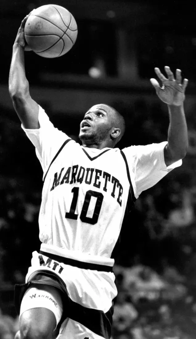 Marquette basketball player Tony Miller goes up for a layup, 1991-1995