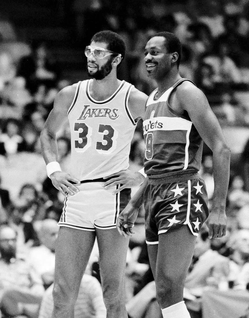 INGLEWOOD, CA - DECEMBER 08: (EDITORS NOTE: Image has been shot in black and white. Color version not available.) Kareem Abdul-Jabbar #33 of the Los Angeles Lakers talks with Jim Chones #9 of the Washington Bullets during a game at The Forum, in Inglewood, California. (Photo by Jayne Kamin-Oncea/Getty Images)
