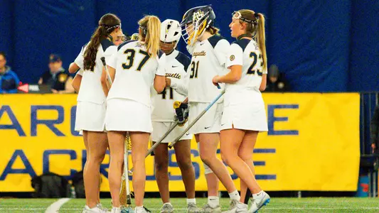 WLAX huddle White
