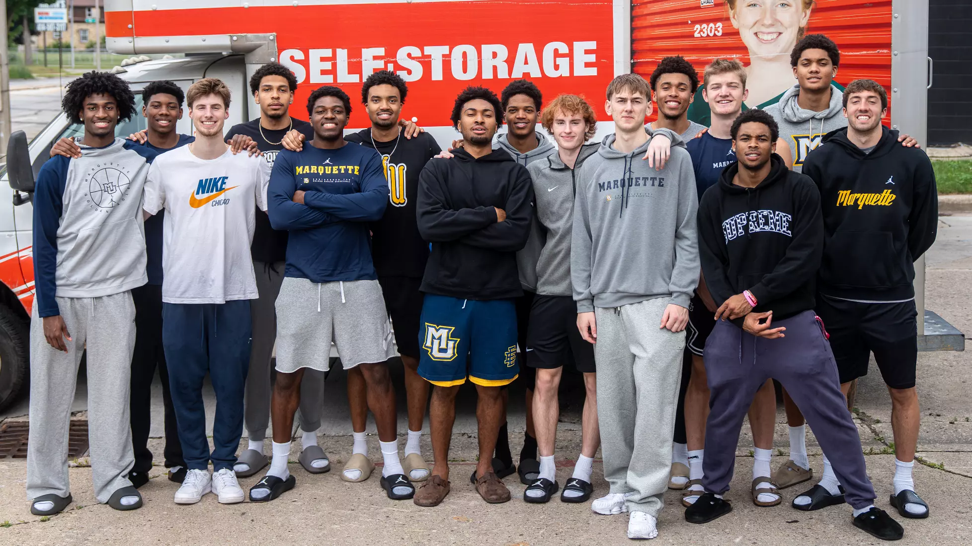 #MUBB team poses in front of U-Haul trailer on reveal day