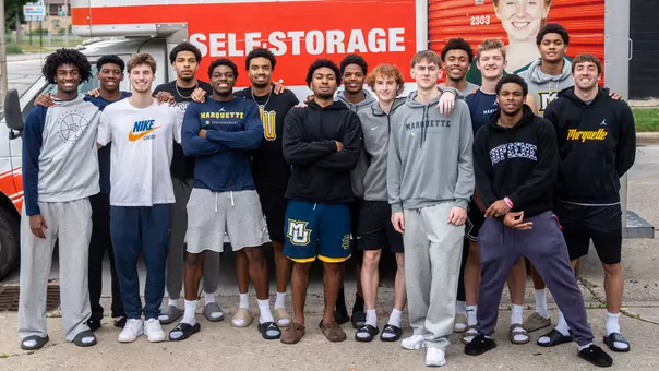 #MUBB team poses in front of U-Haul trailer on reveal day