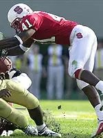 Georgia Tech running back Joe Burns is stopped by N.C. State's J.J. Washington during the first half.