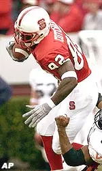 NC State receiver Jerricho Cotchery fights for extra yardage.