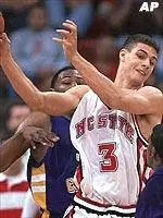 North Carolina State's Ilian Evtimov tries to control the ball as he gets caught between East Carolina defenders.