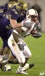 Pittsburgh's Joe Conlin, brings down North Carolina State's split end Bryan Peterson, during the first quarter of the Tangerine Bowl in Orlando, Fla.