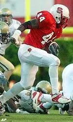 T.A. McLendon (44) breaks away from Georgia Tech defenders during the first half.