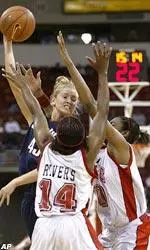 Nanna Rivers (14) and Kaayla Chones, right, double team Connecticut's Ann Strother.