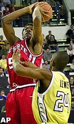 Marcus Melvin shoots during the first half.