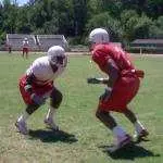J.J. Washington and Bryan Peterson are roommates off the field, but fight it out every day in practice.