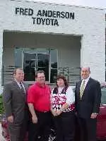 Winner of the Toyota Kickoff Payoff, Pam Wilcher, picked a 2003 Red Toyota Camry. Pictured from left to right: Jerry Reckerd, GM--Wolfpack Sports Marketing, Al Wilcher, Pam Wilcher and Fred Anderson.