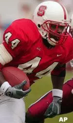 T.A. McLendon passes University of Massachusetts defenders on his way to 117 yards rushing.