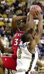 Josh Powell is fouled by Georgia Tech's Isma'il Muhammad as Powell drives to the basket during the first half.