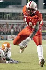 T.A. McLendon hurdles Clemson defender Ryan Charpia to score a touchdown during the first quarter.