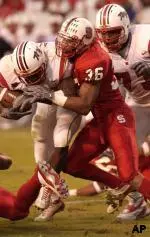 Maryland's Josh Allen is tackled by NC State safety Andre Maddux.