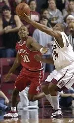 NC State's Clifford Crawford and Temple's David Hawkins go after to a loose ball.