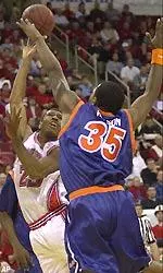Scooter Sherrill shoots over Travis Watson in the first meeting between NC State and Virginia.