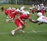 The offensive front takes on the defensive front in practice Monday.