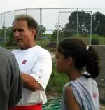 Junelle Demarest monitors Coach Amato's post-practice interview.