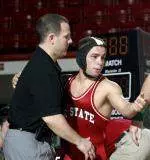 Assistant wrestling coach Carter Jordan (left) has been promoted to associate head coach.