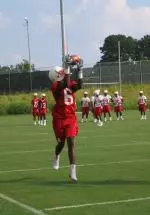 Richard Washington pulls down one of many catches during the first practice.