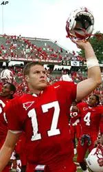 Philip Rivers (17) celebrates with teammates after a 47-34 win over North Carolina.