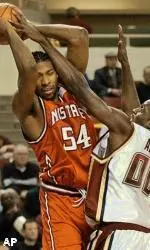 NC State's Marcus Melvin tries to drive to the basket past Boston College's Uka Agbai in the first half.