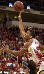 Scooter Sherrill drives over Georgia Tech's Anthony McHenry during the first half.
