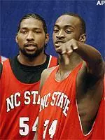 Marcus Melvin and Julius Hodge chat during Thursday's NCAA practice in Orlando.