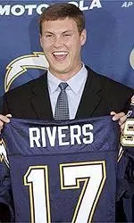 Quarterback Philip Rivers holds up his San Diego Chargers jersey at a news conference at the Chargers' facility in San Diego Sunday, April 25, 2004. The Chargers traded No. 1 draft pick Eli Manning to the New York Giants for Rivers and future draft picks.