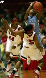 North Carolina's Ivory Latta collides with Ashley Key as Tiffany Stansbury looks on during the first half Friday night in Raleigh.