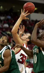 Ben McCauley, center, reaches for the ball between Stetson's Trevour McIntosh, right, and Garfield Blair, left, during the first half of a Hispanic College Fund Classic game in Raleigh, N.C. (AP Photo/Gerry Broome)