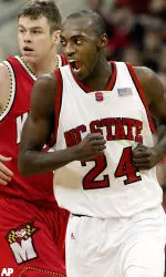 Julius Hodge celebrates late in the first half with Maryland's Mike Grinnon in the background.