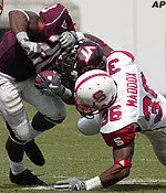 NC State and Virginia Tech -- seen here battling last year in Blacksburg -- will open the 2005 season on Sunday, September 4th.