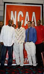 The Pack stands in front of the new NCAA banner that will hang at the RBC Center celebrating the trip to the Sweet 16.