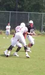 Manny Lawson disrupts a play in the backfield during Friday's practice.