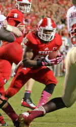 Tony Creecy looks for the endzone against Florida State.