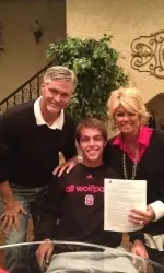 Parker McGuiness with his parents on signing day