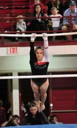 Rachel Fincham performing a routine on the uneven parallel bars