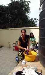 Senior Tatianna Illova hand-washing her clothes in Ghana