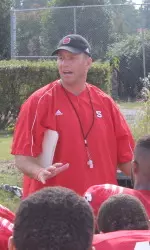 Coach Doeren talks to the Pack after Thursday's practice.