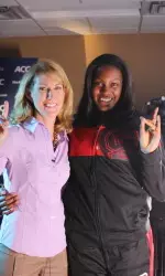 Kody Burke poses with former Wolfpack player and current ESPN college basketball/WNBA analyst Debbie Antonelli