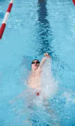 Freshman Andreas Schiellerup set a new school record in the 100 backstroke with a time of 46.67
