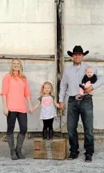 Olin and his wife Natalie with their daughters Cheznie and Kenndy.